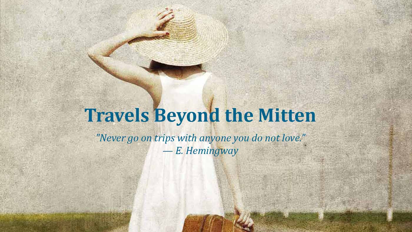 travels beyond the mitten girl with suitcase